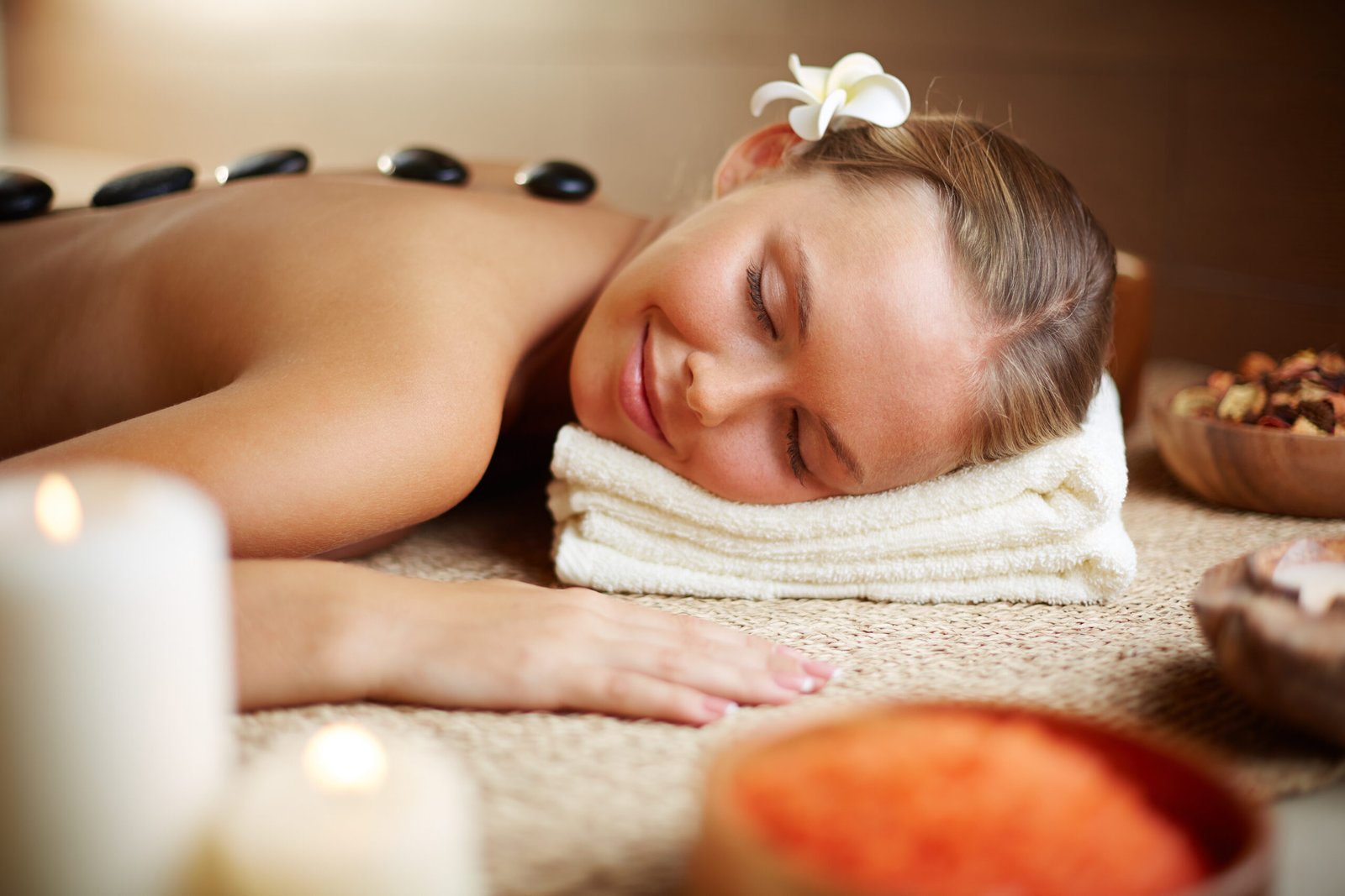 Portrait of young female enjoying spa procedure in beauty salon